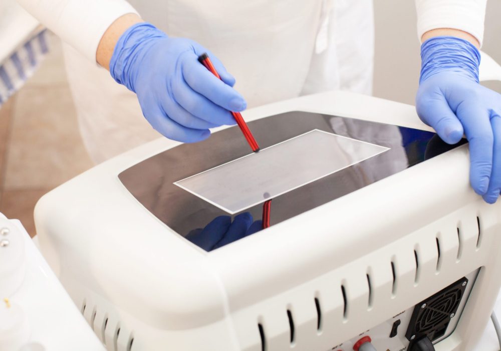 woman-is-setting-up-laser-hair-removal-machine-2023-11-27-04-51-16-utc-scaled-1-scaled